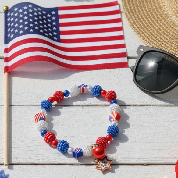 Beaded bracelet with red, blue, and white beads on a gray background