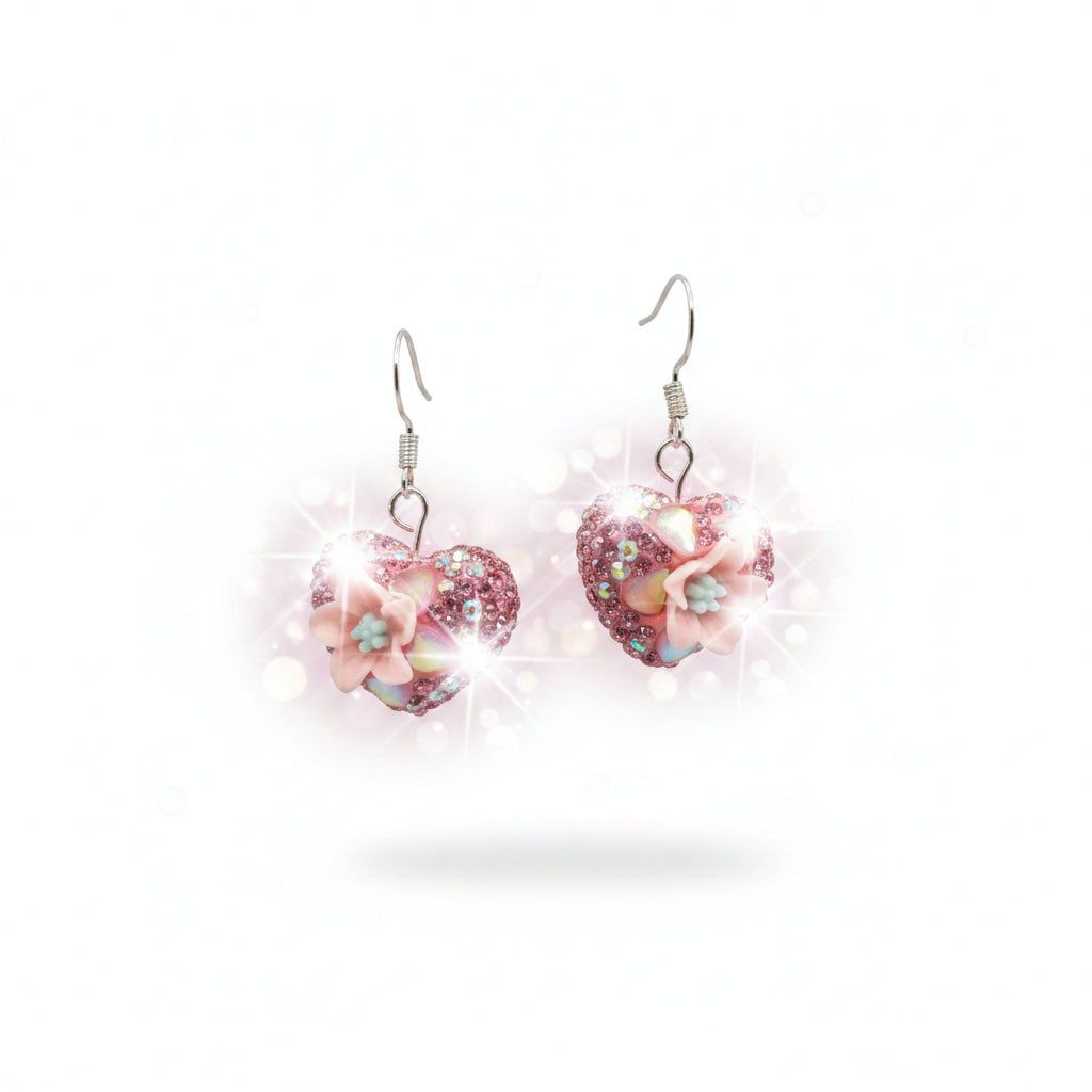 Heart-shaped earrings with pink and iridescent finish on a gray background