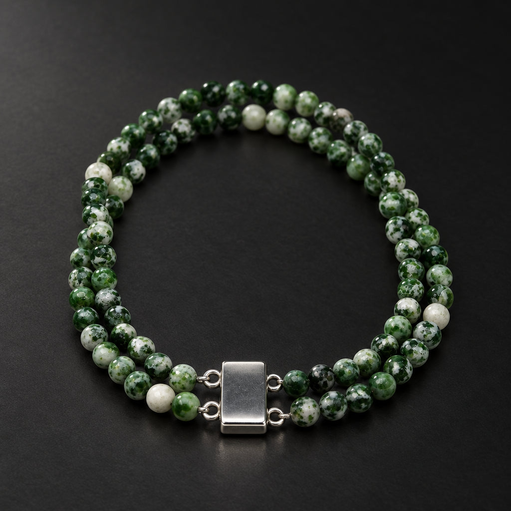 A double-strand beaded necklace made of green and white marbled beads with a rectangular silver clasp, displayed on a plain light gray background.