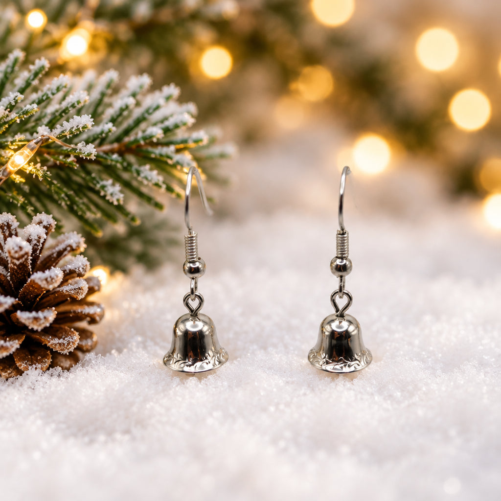 A pair of silver bell-shaped dangle earrings hanging from a clear plastic display stand against a plain light gray background.