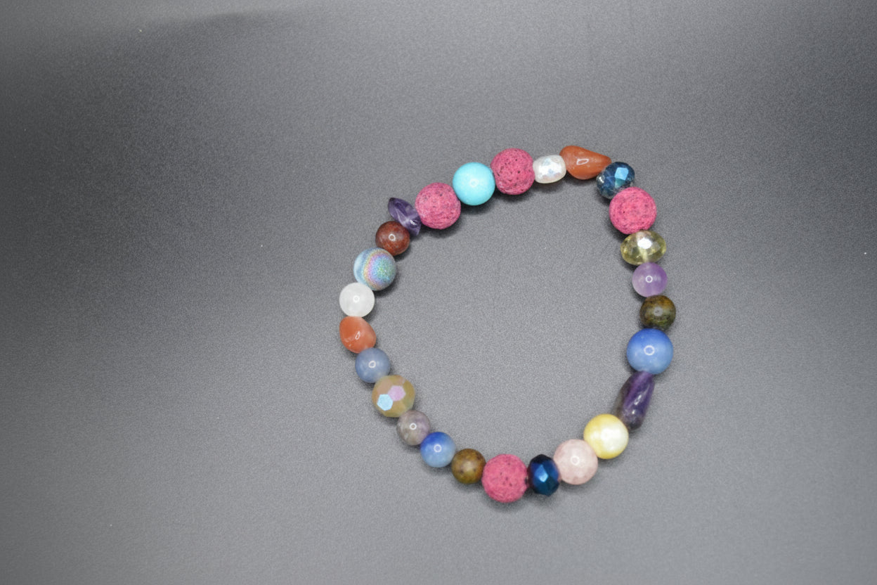 Multicolored beaded bracelet on a gray background