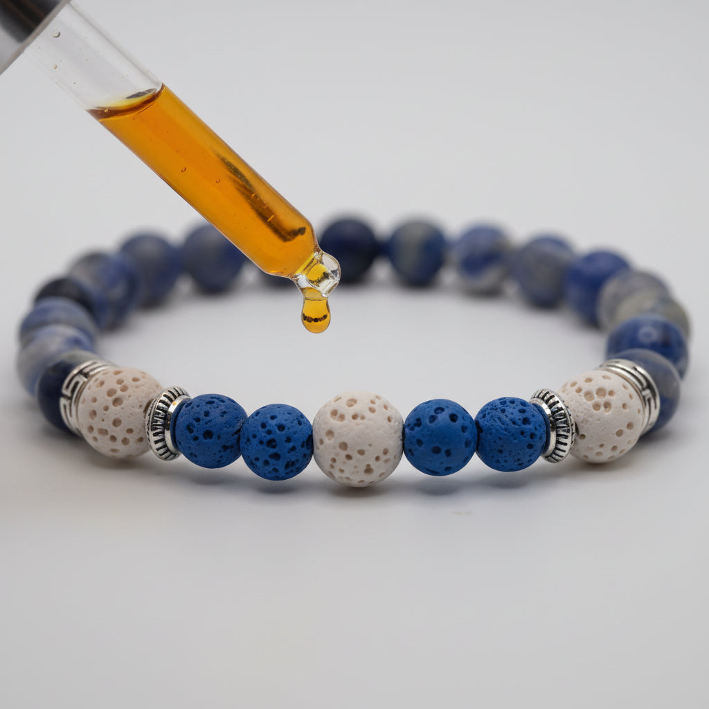 A beaded stretch bracelet featuring blue and white marbled beads, textured blue beads, white speckled beads, and silver spacer rings, displayed on a neutral gray background.