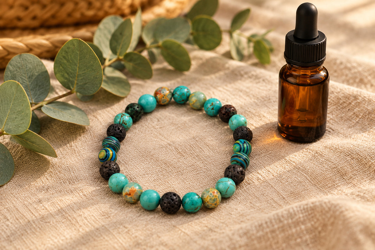 A beaded stretch bracelet made of round turquoise, black, and marbled beads, displayed on a neutral gray background.