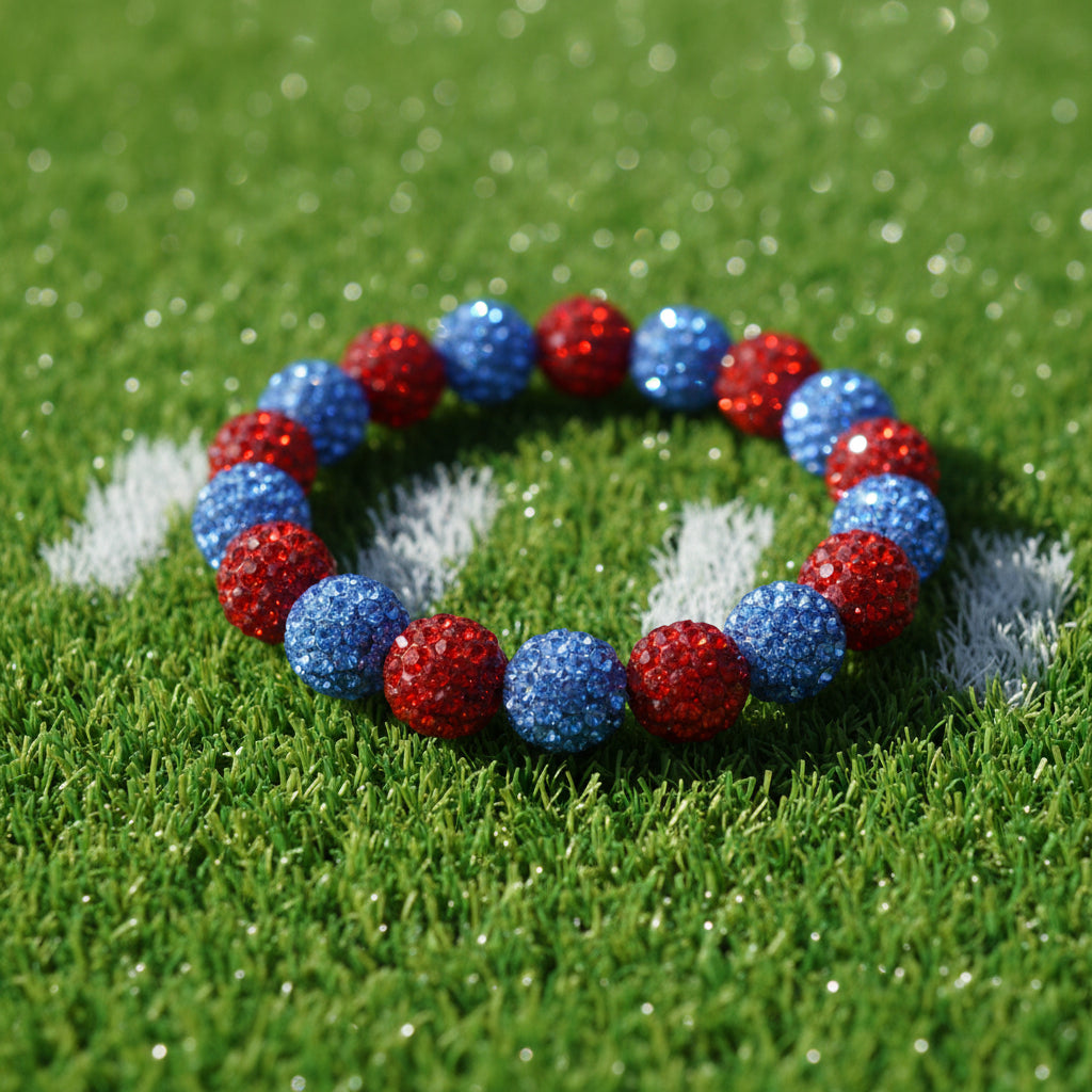 A beaded stretch bracelet featuring alternating red and blue glittery round beads, displayed on a plain light gray background.