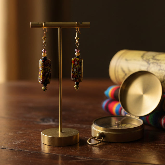 Multicolored beaded earrings on a gray background