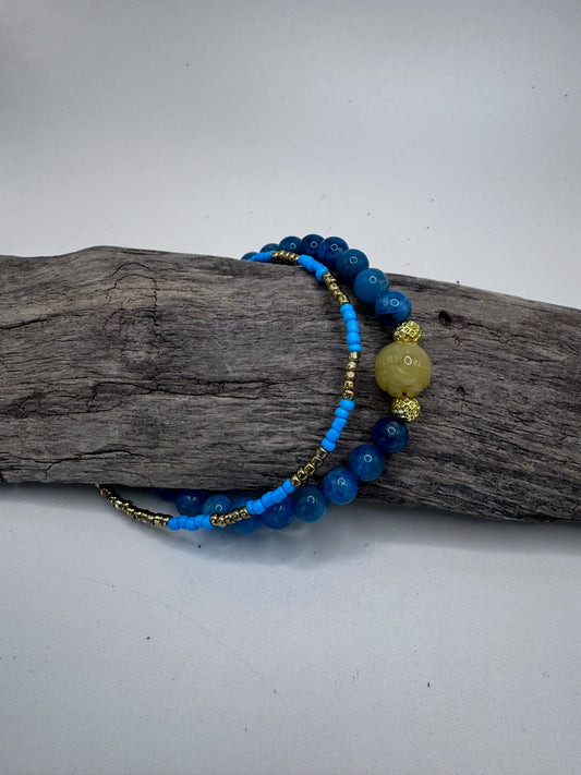 Double-Stranded Bracelet with Vibrant Blue Gemstones and Gold Accents