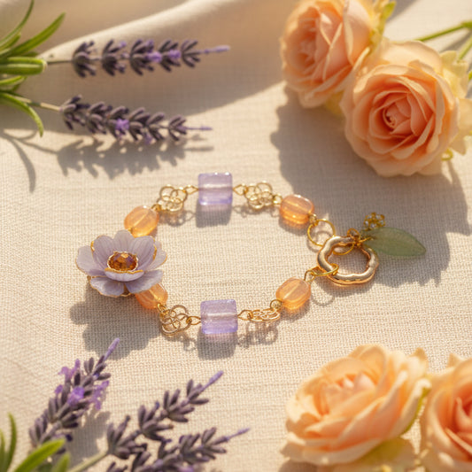 Bracelet with colorful beads and a flower charm on a gray background