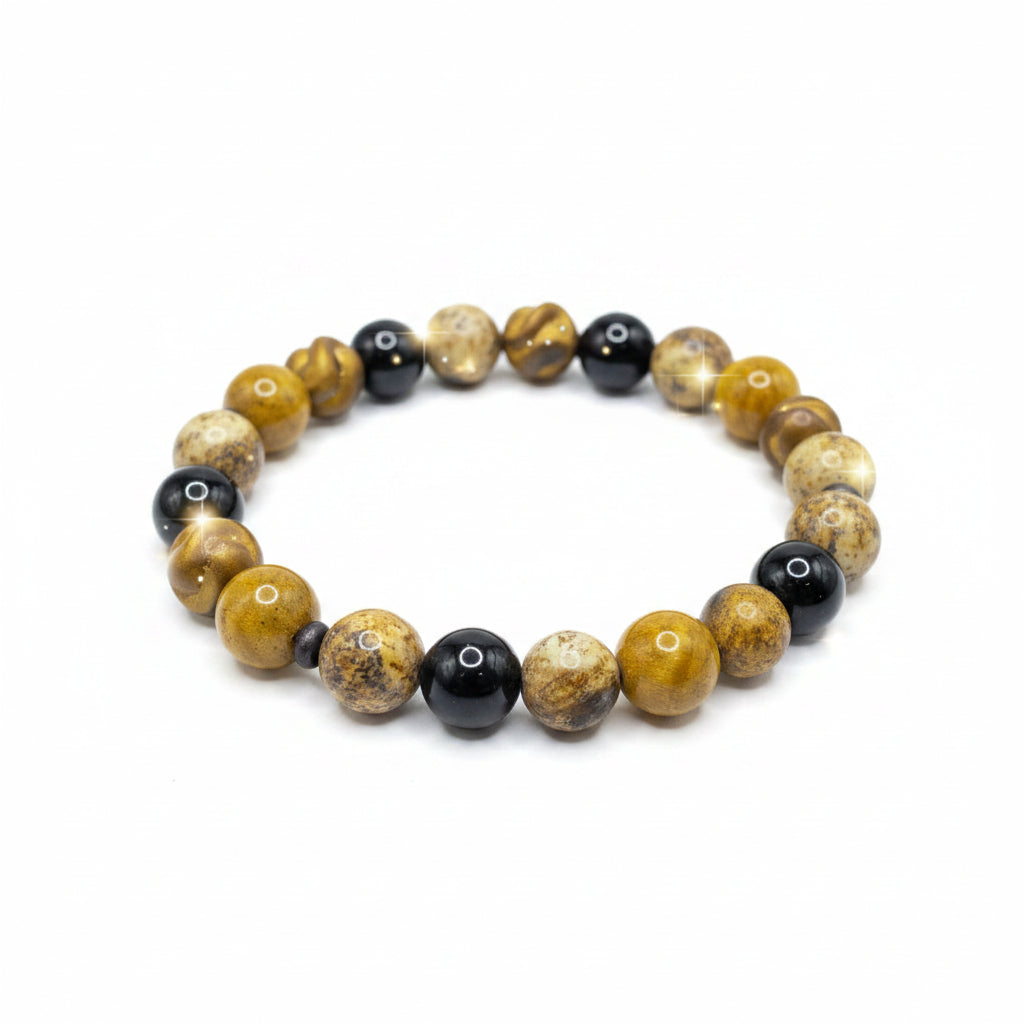 Bracelet with yellow and black beads on a wooden stick against a dark background