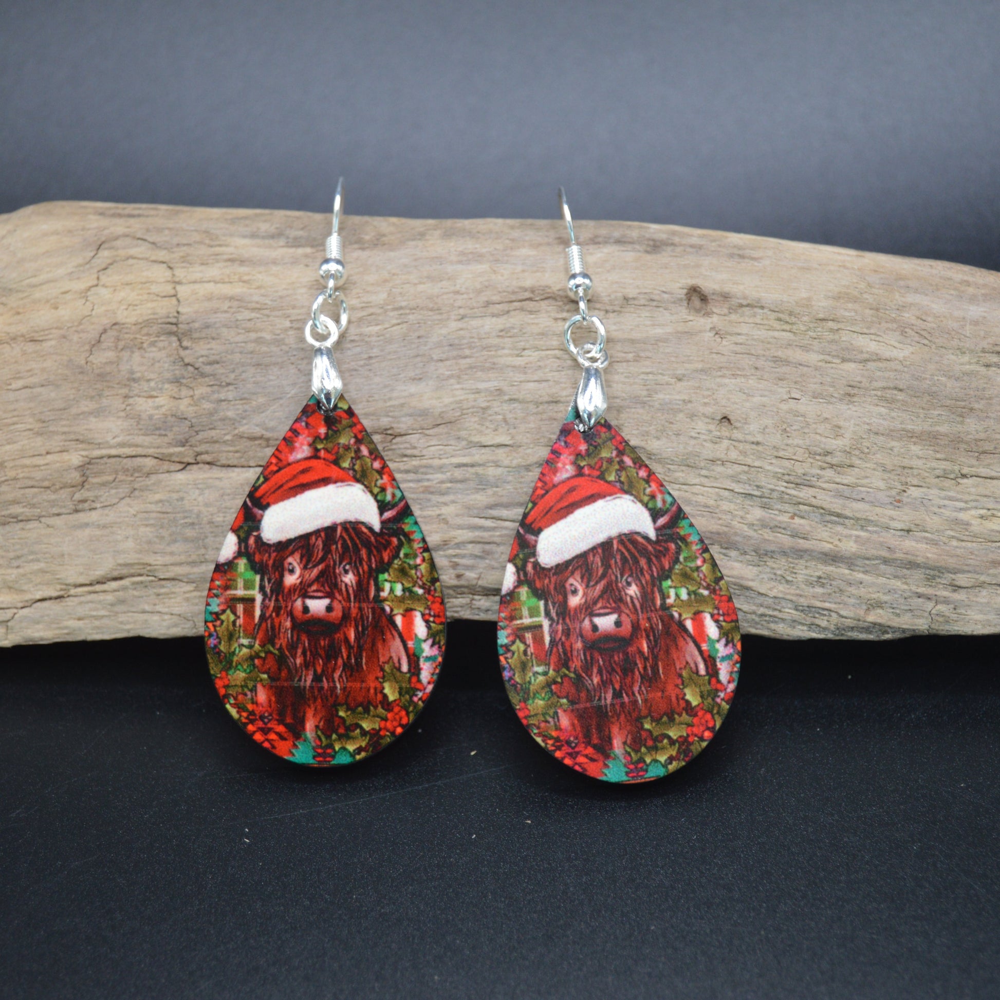 Decked out in a Santa hat and surrounded by holiday cheer, this Christmas cow brings farm-fresh festivity to your ears. A playful twist on seasonal style—perfect for animal lovers and merry mischief-makers alike.