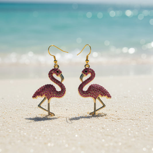 Flamingo-shaped earrings with pink and gold details on a gray background
