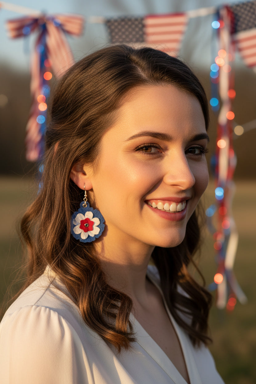 Floral earrings with blue, red, and white colors on a dark background