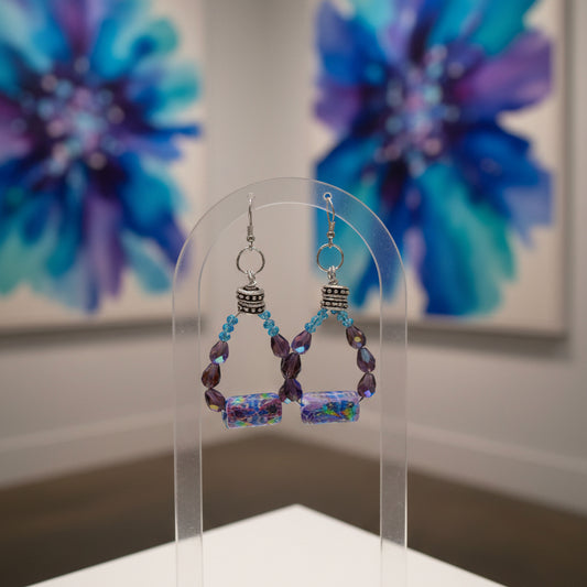 Beaded earrings with colorful beads on a gray background