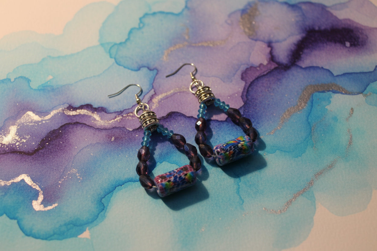 Pair of beaded earrings on a gray background