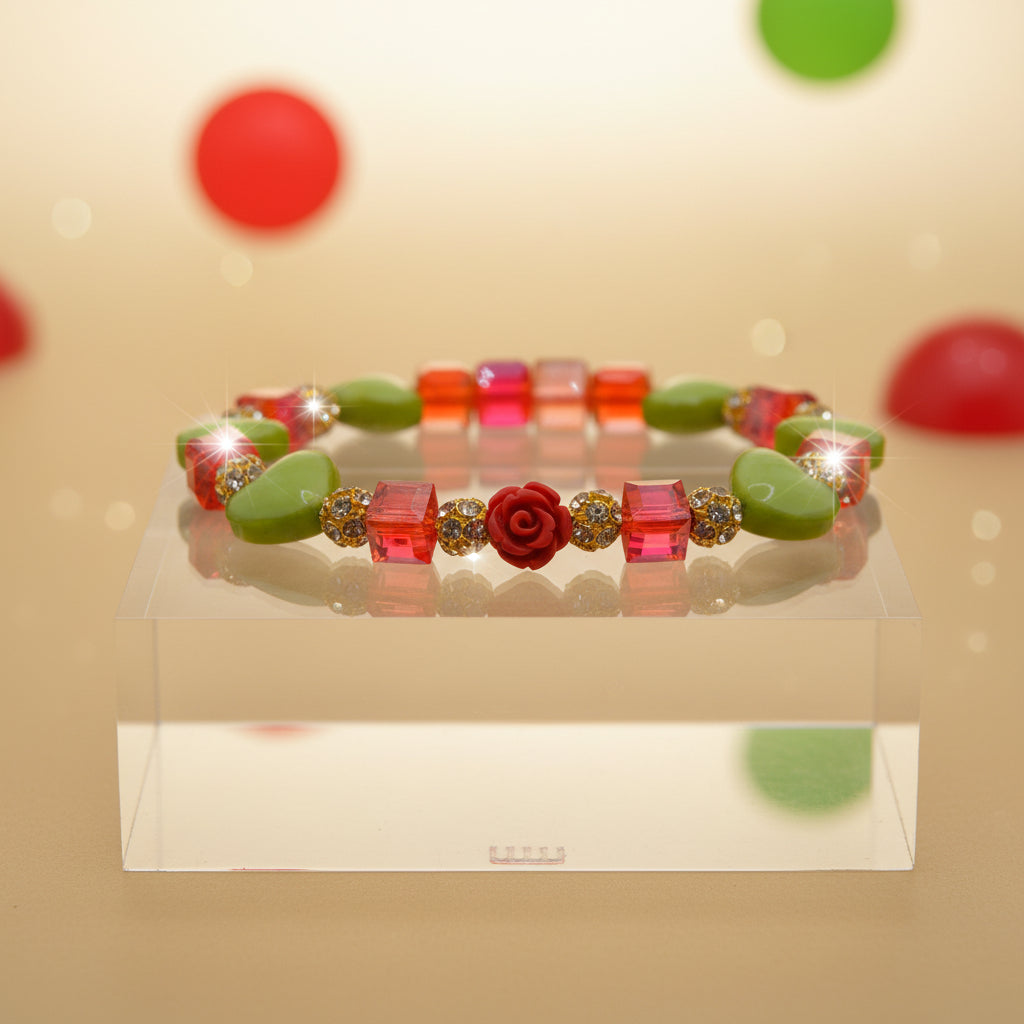 A beaded stretch bracelet featuring lime green and translucent orange-red beads, accented with small gold-tone spacers and a central red rose bead, displayed on a neutral light gray background.