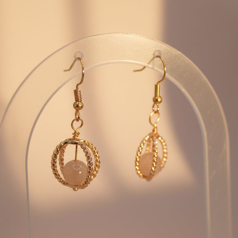 Gold earrings with a clear background