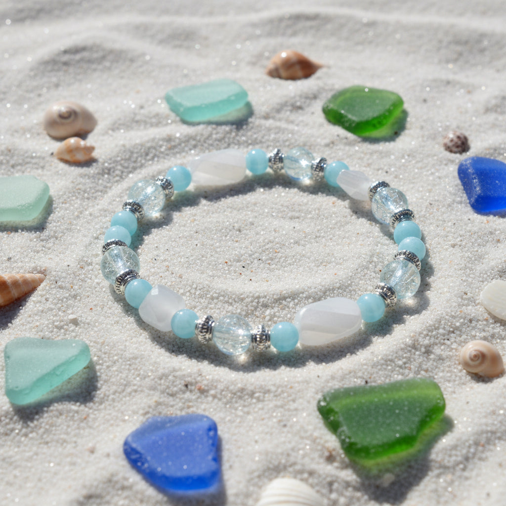 Beaded bracelet with blue and clear beads on a white background