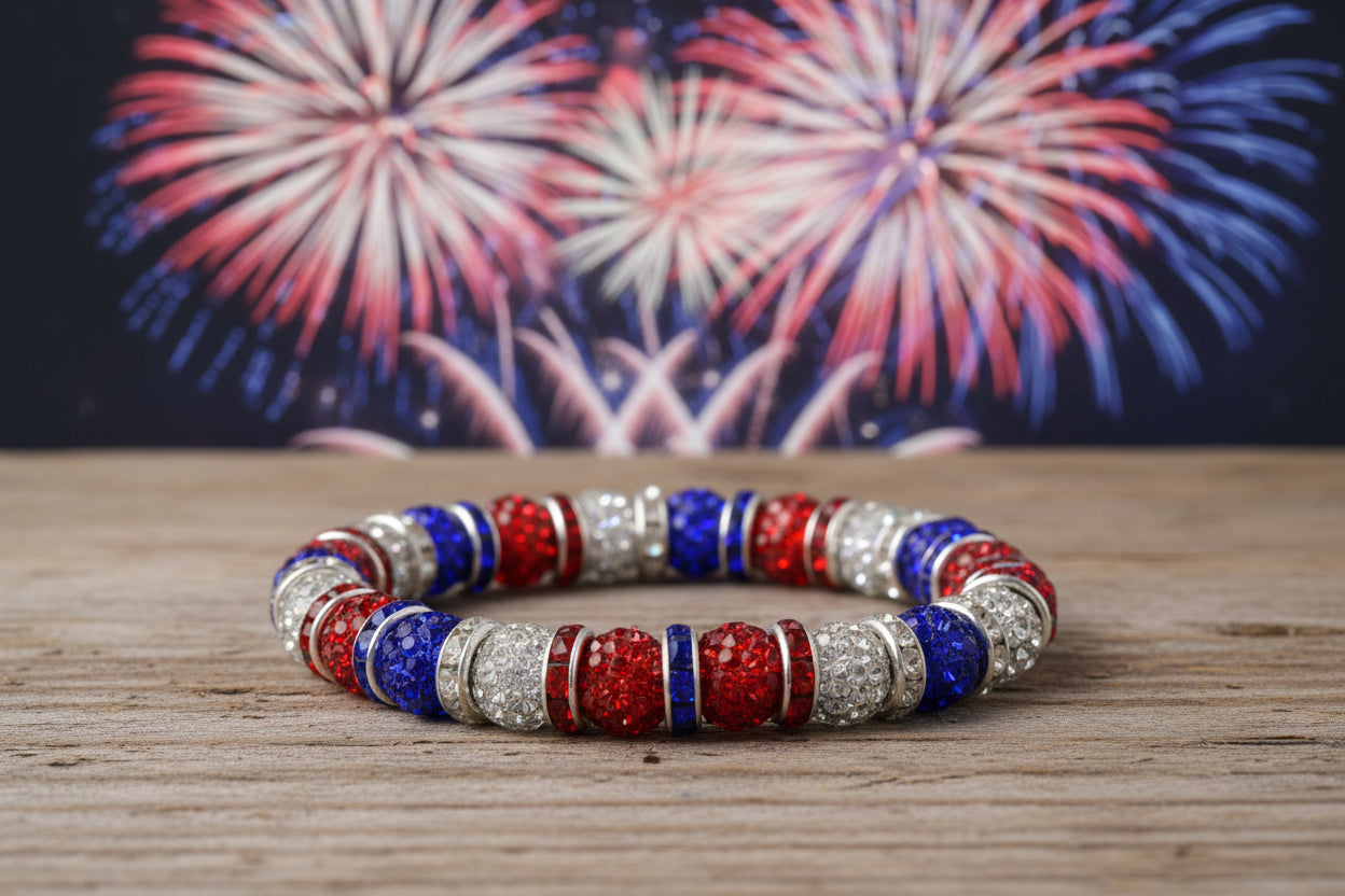 Bracelet with red, blue, and silver beads on a gray background