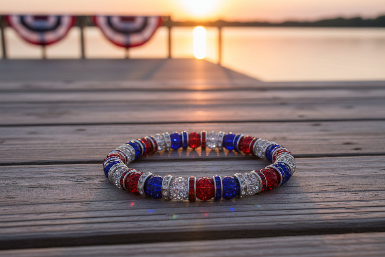 Bracelet with red, blue, and silver beads on a gray background