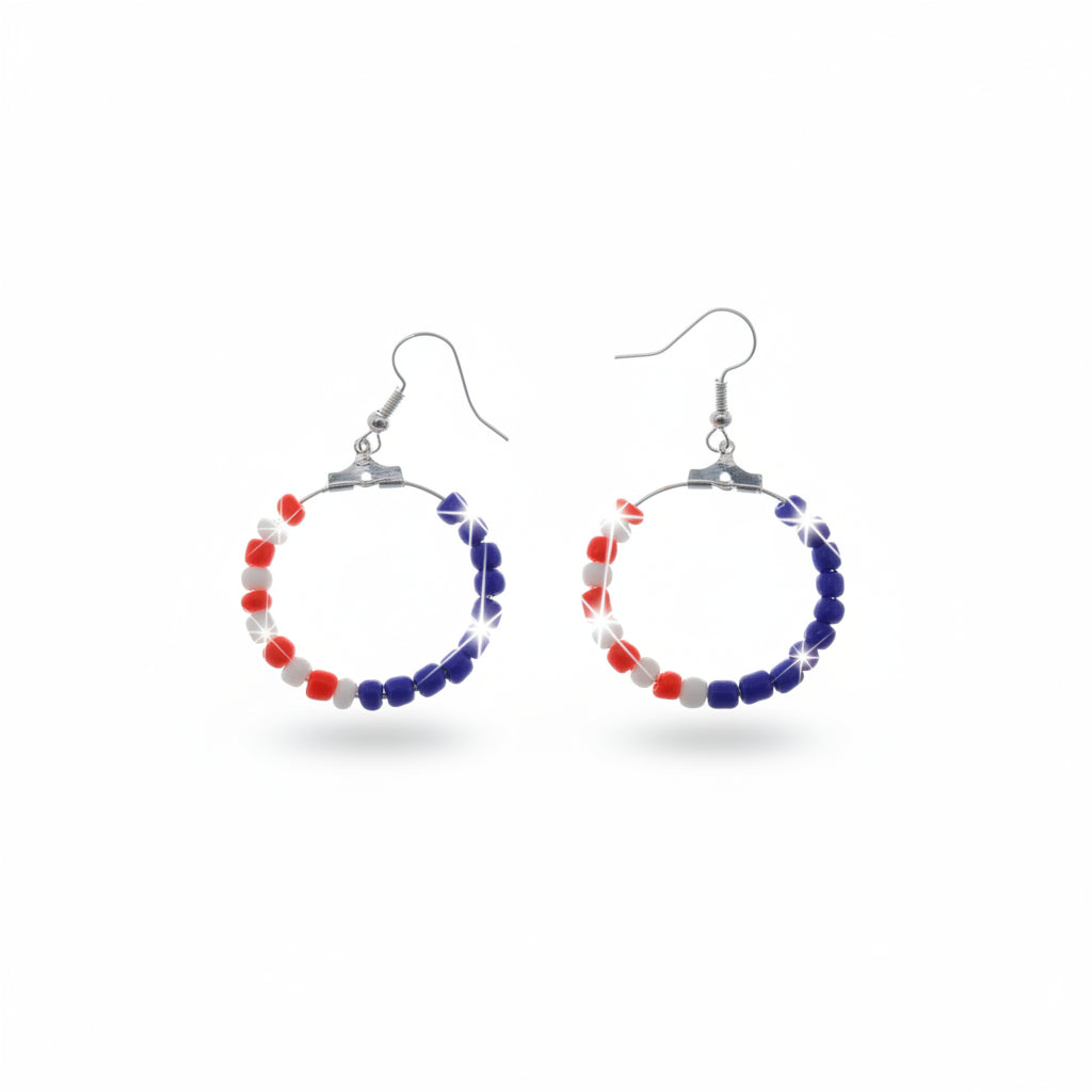 Pair of hoop earrings with red and blue beads on a gray background