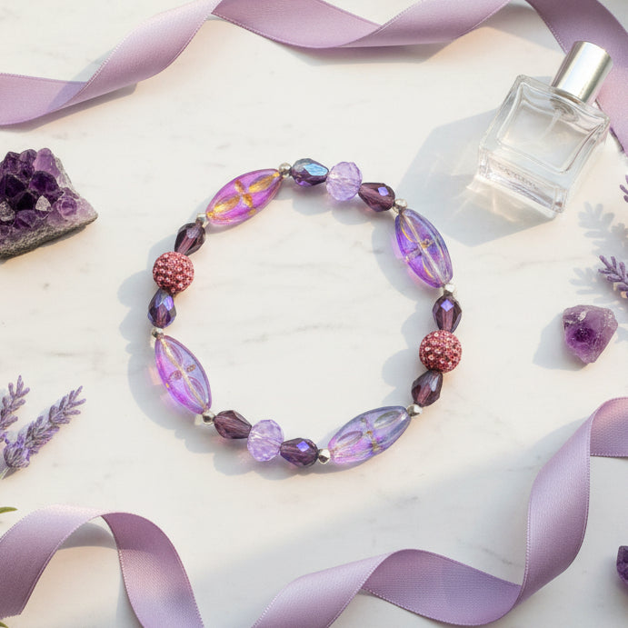 Necklace with purple and pink beads on a gray background