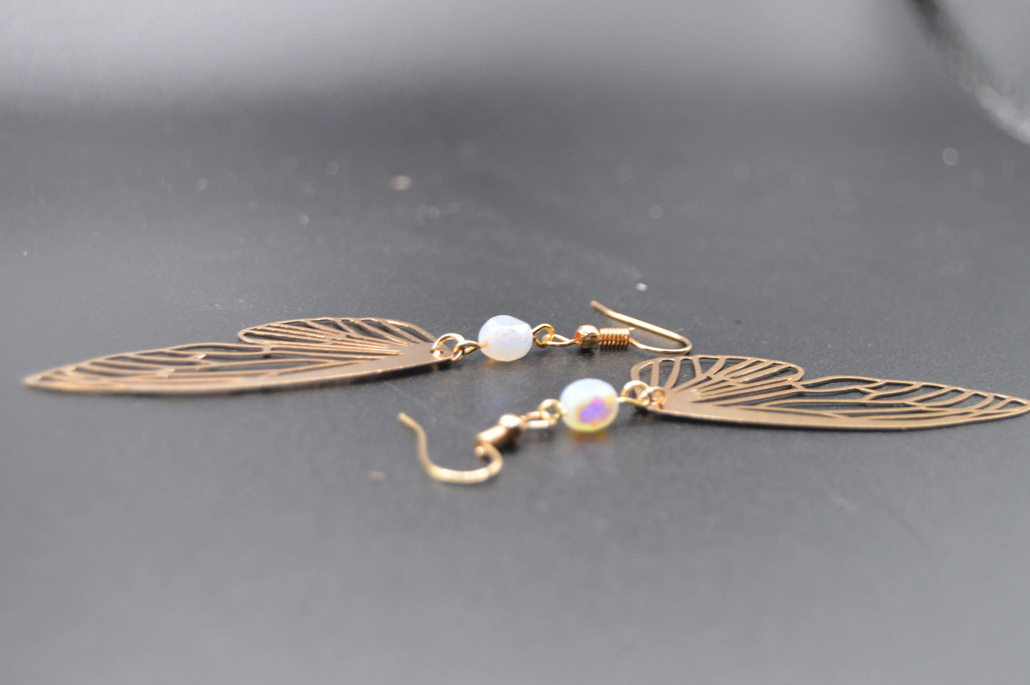 Heavenly Glow: Angel Wings Earrings with Pearl-Colored Crystal