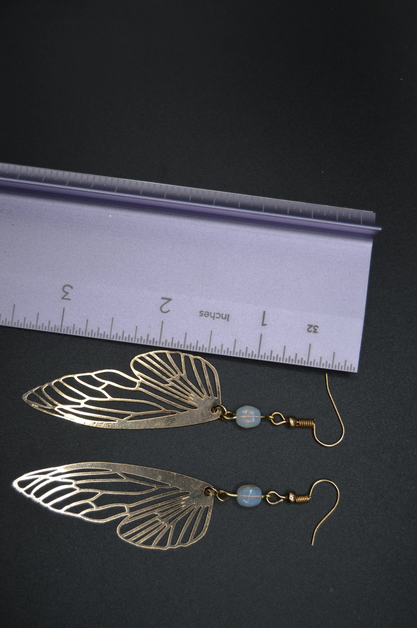 Heavenly Glow: Angel Wings Earrings with Pearl-Colored Crystal