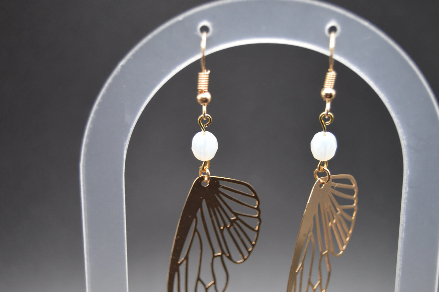 Heavenly Glow: Angel Wings Earrings with Pearl-Colored Crystal