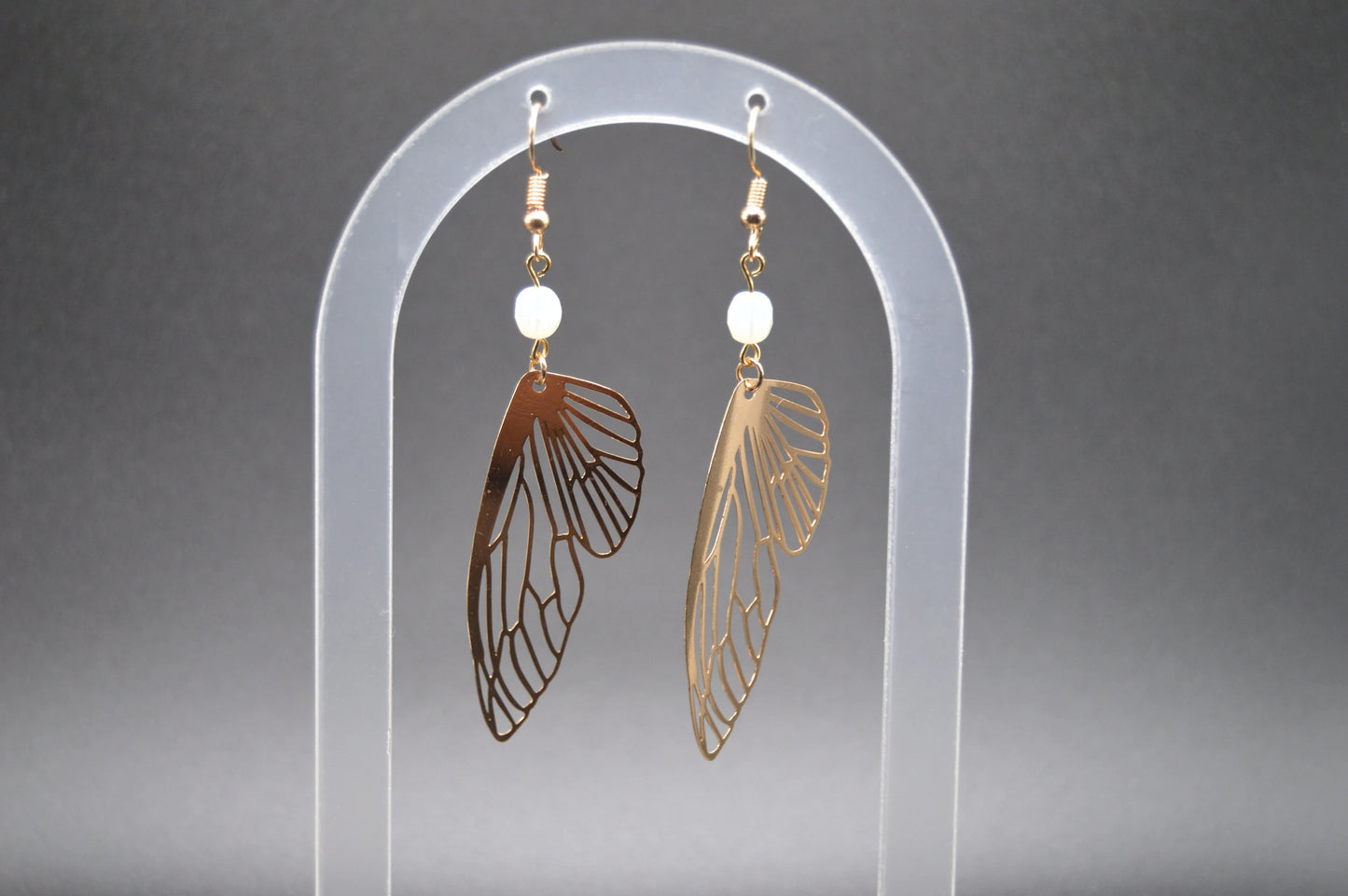 Heavenly Glow: Angel Wings Earrings with Pearl-Colored Crystal