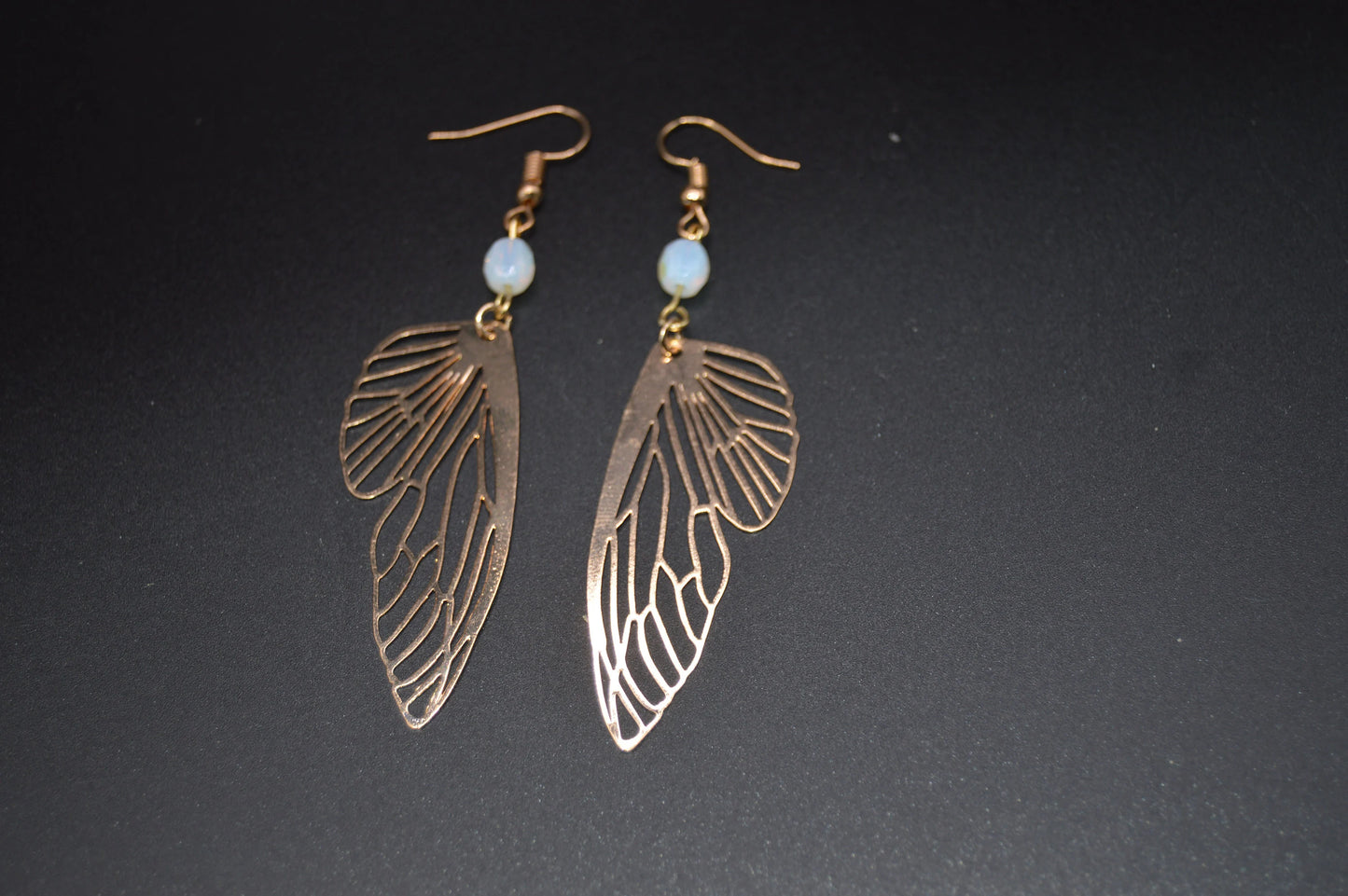 Heavenly Glow: Angel Wings Earrings with Pearl-Colored Crystal